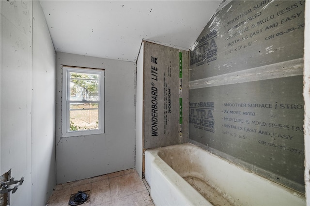 bathroom featuring a tub to relax in