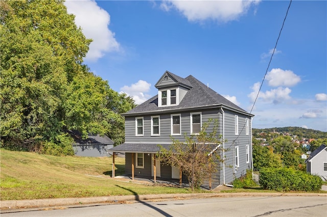 view of front of house featuring a porch and a front lawn