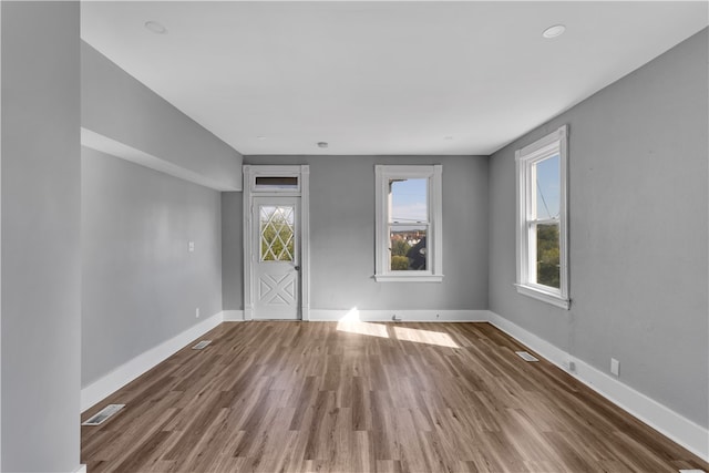 empty room with wood-type flooring