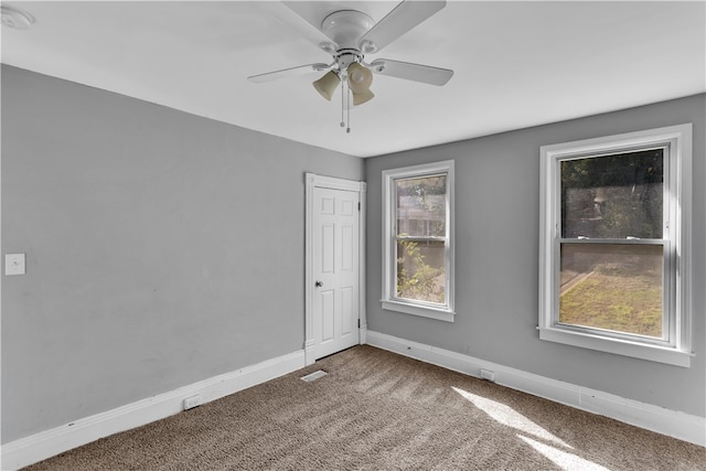 carpeted empty room with ceiling fan