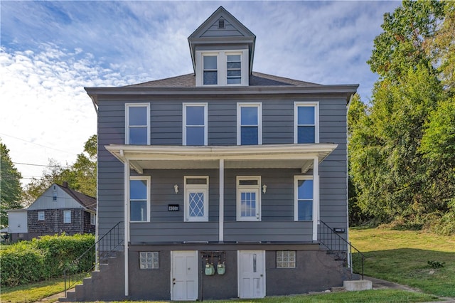 view of front of property with a front lawn and covered porch