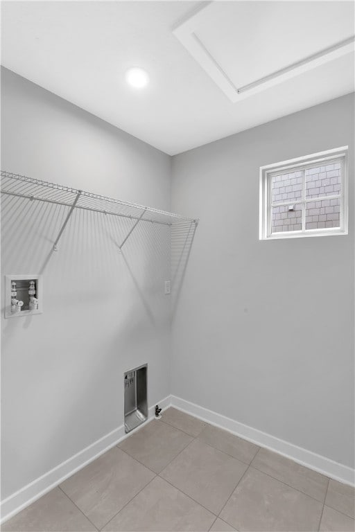 laundry room featuring hookup for a washing machine and tile patterned floors