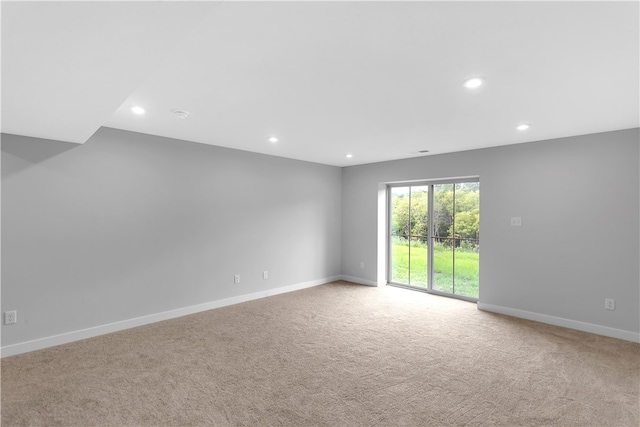 empty room with light colored carpet