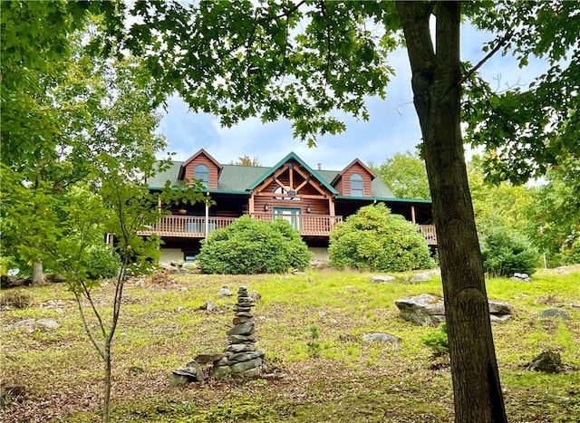 log home featuring a deck