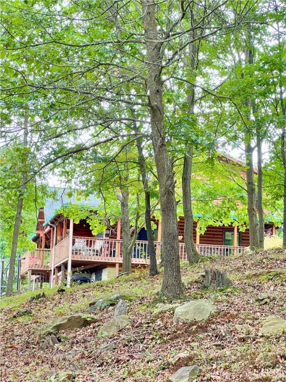 view of yard featuring a wooden deck