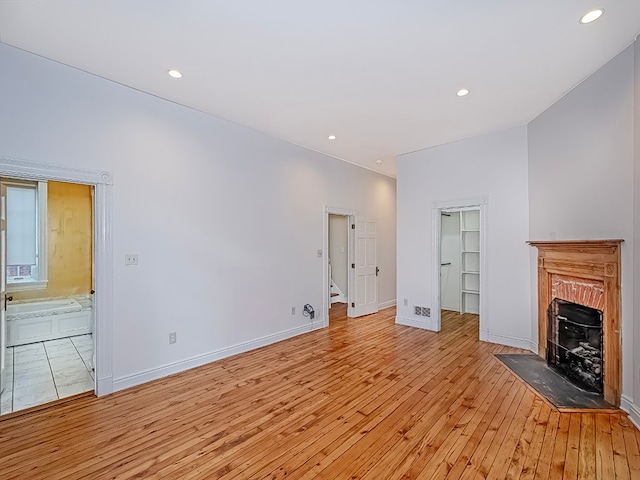 unfurnished living room with light wood-type flooring