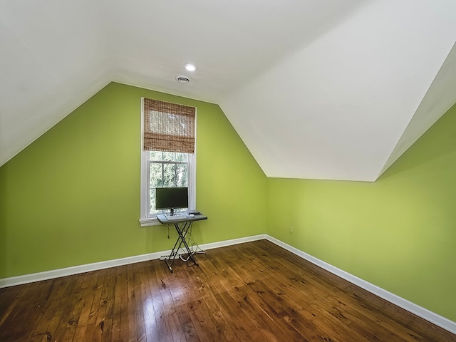 bonus room featuring vaulted ceiling and hardwood / wood-style flooring