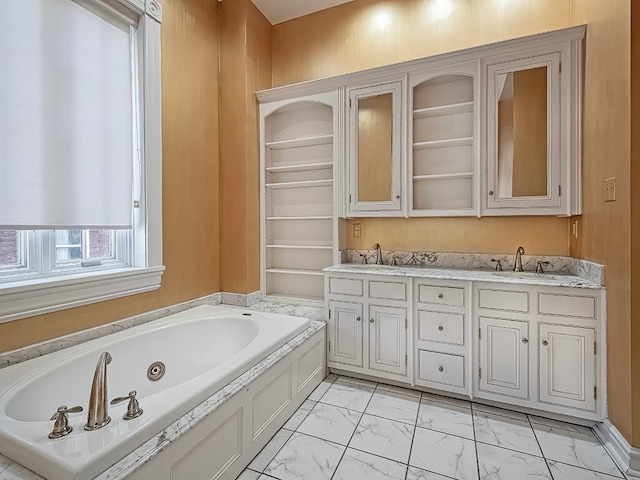 bathroom with vanity and a washtub