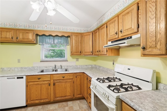 kitchen featuring white appliances, sink, and ceiling fan