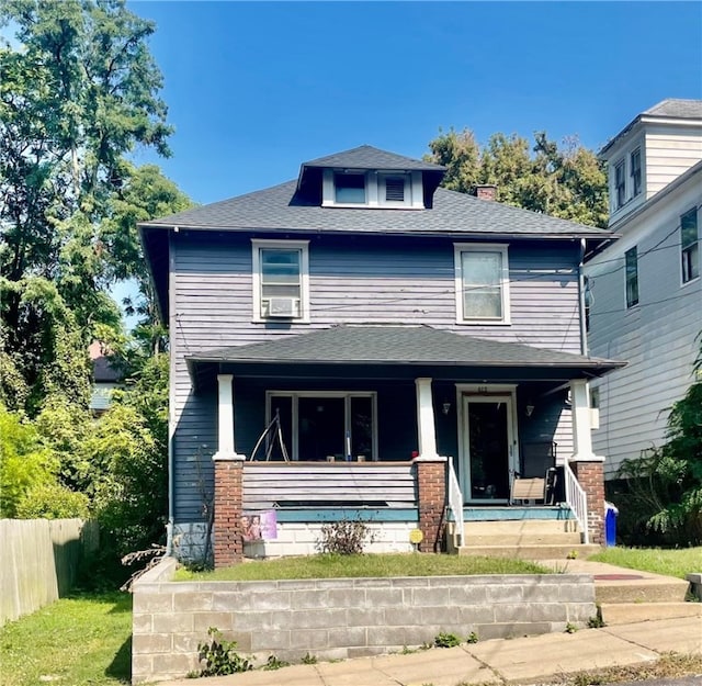 view of front of property featuring cooling unit and covered porch