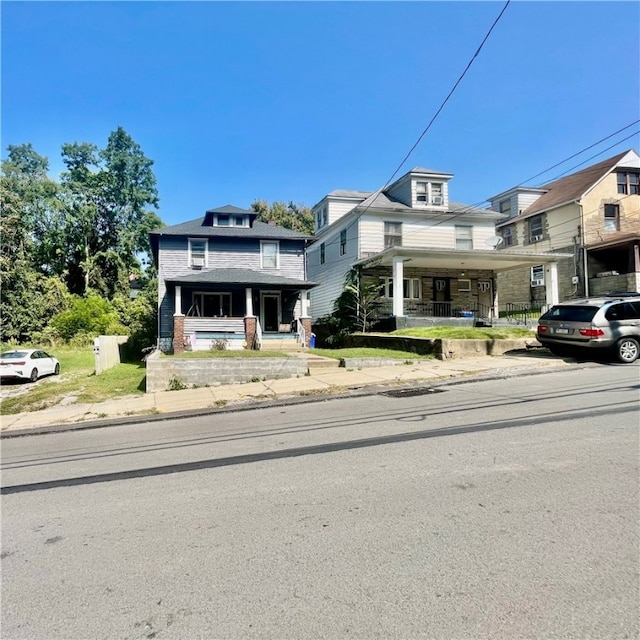 view of front of property with a garage and covered porch