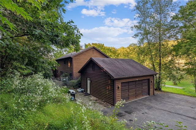 exterior space with an outdoor structure and a garage