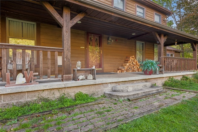 property entrance with covered porch