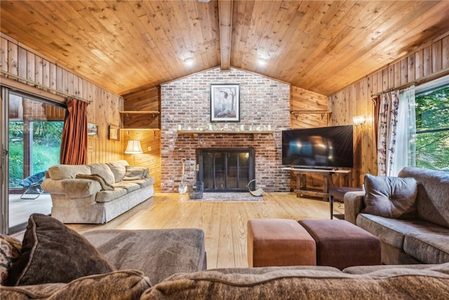 living room featuring vaulted ceiling with beams, wood-type flooring, wooden walls, wooden ceiling, and a fireplace