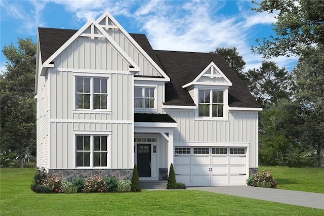 view of front of house with a front yard and a garage