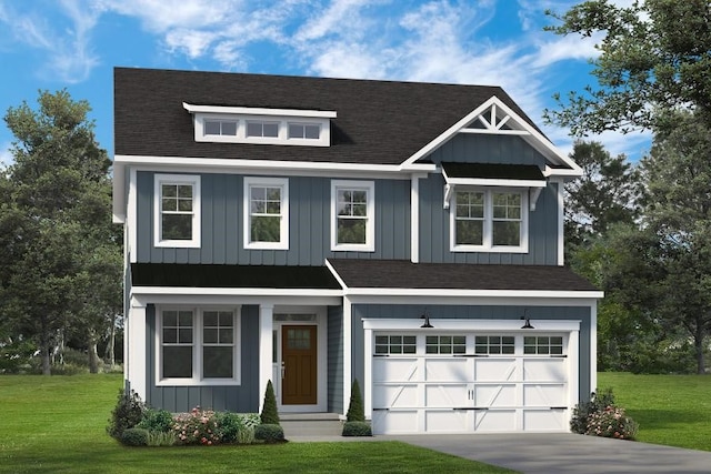 view of front of house featuring a front yard and a garage