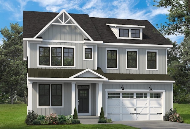 view of front of house featuring a front yard and a garage