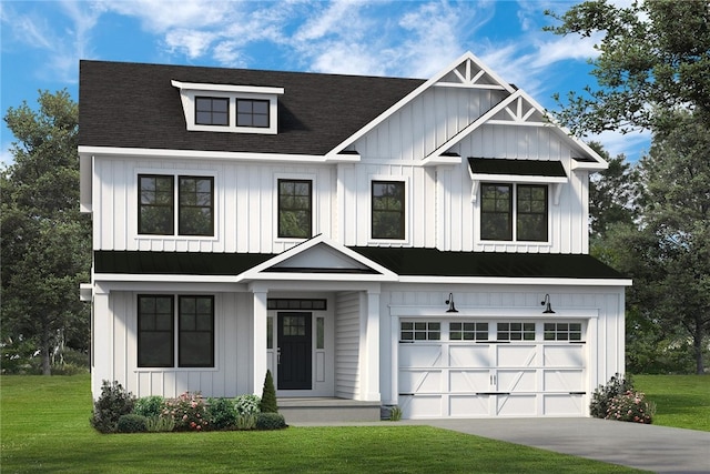 view of front of property with a front yard and a garage