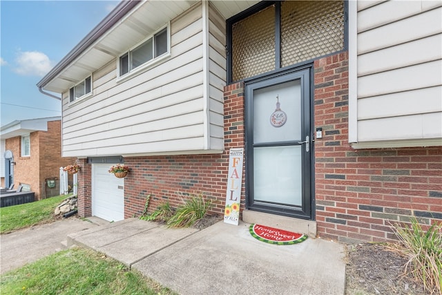 entrance to property featuring a garage