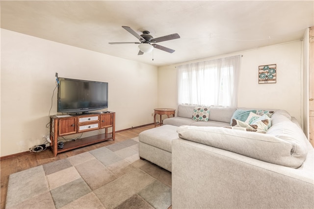 living room with ceiling fan and hardwood / wood-style flooring