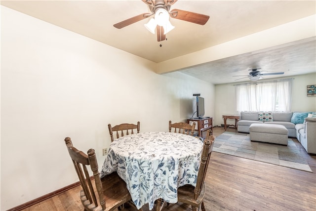 dining area featuring ceiling fan and hardwood / wood-style floors