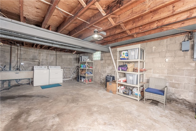 basement featuring sink and washing machine and clothes dryer