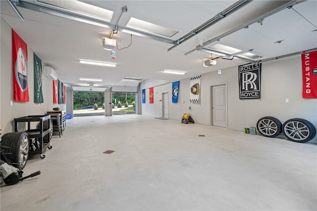 garage featuring an AC wall unit and a garage door opener