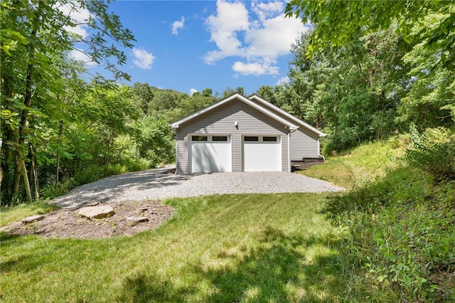 garage with a yard