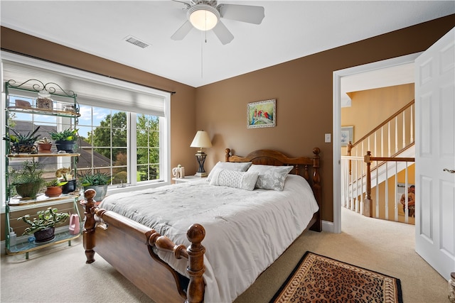 carpeted bedroom with ceiling fan