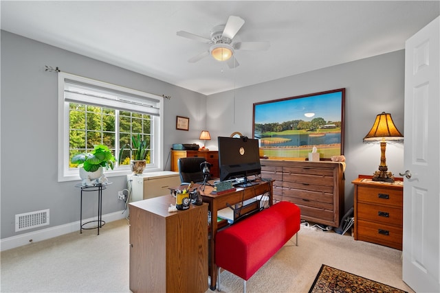 office space featuring ceiling fan and light colored carpet