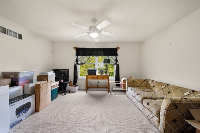 living room with ceiling fan and carpet flooring