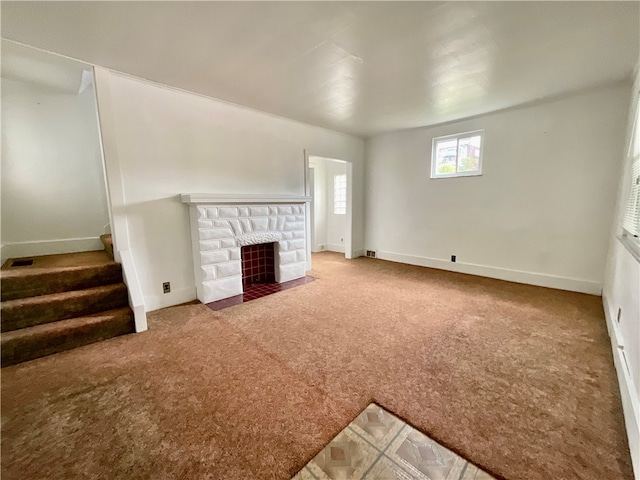 unfurnished living room featuring carpet flooring