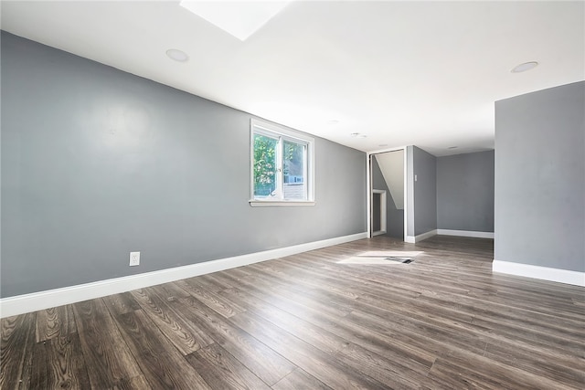 spare room featuring wood-type flooring