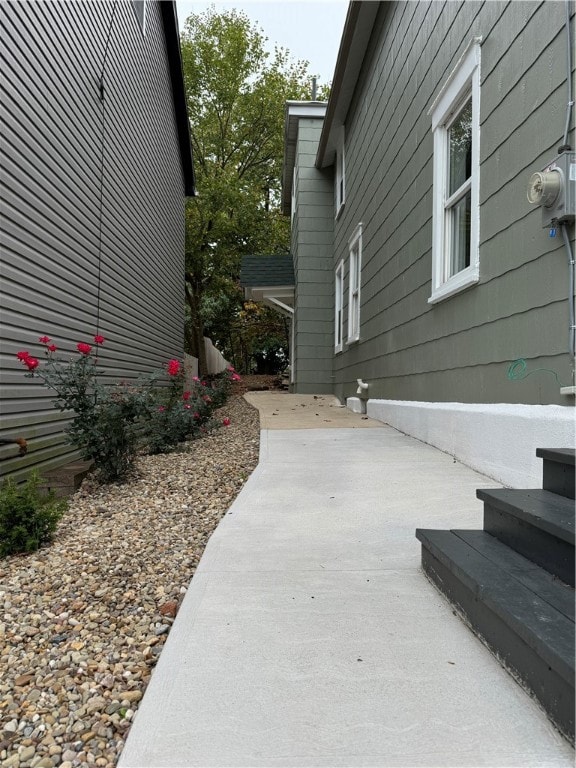 view of side of home with a patio area