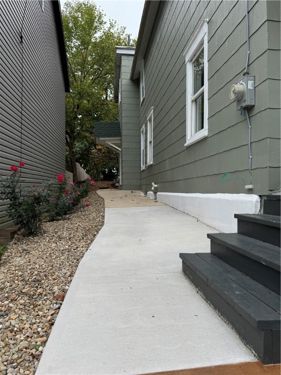 view of side of property featuring a patio