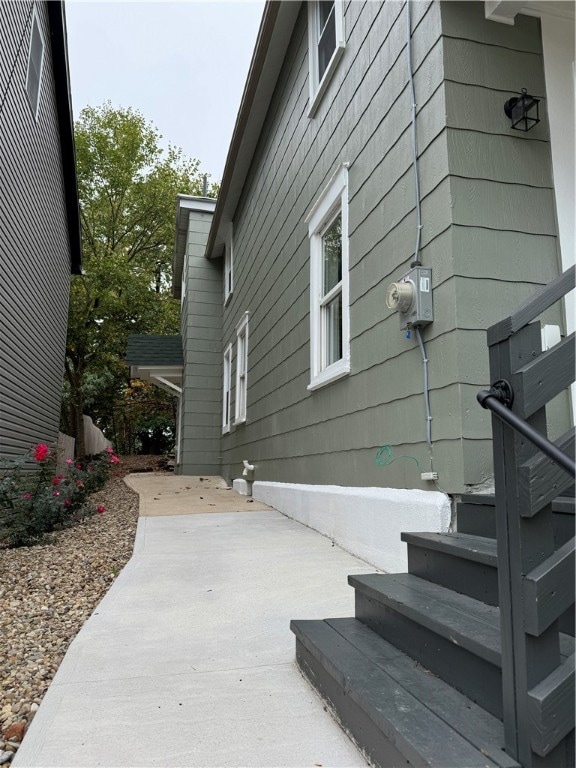 view of property exterior with a patio area