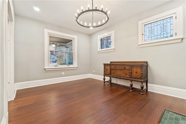 interior space featuring a notable chandelier and dark hardwood / wood-style floors