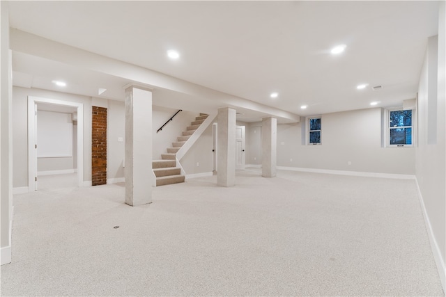 basement with light colored carpet