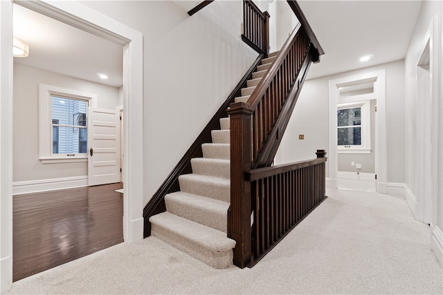 stairway featuring hardwood / wood-style flooring