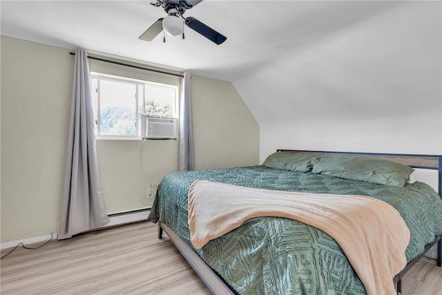 bedroom featuring ceiling fan, cooling unit, light hardwood / wood-style floors, a baseboard heating unit, and vaulted ceiling