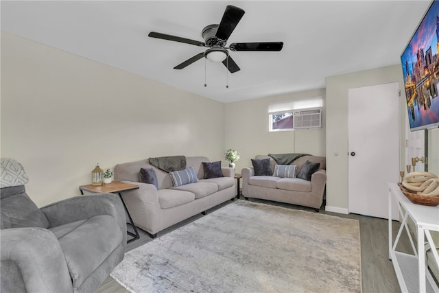 living room with ceiling fan, hardwood / wood-style flooring, and a wall mounted AC