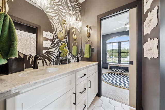 bathroom featuring ceiling fan and vanity