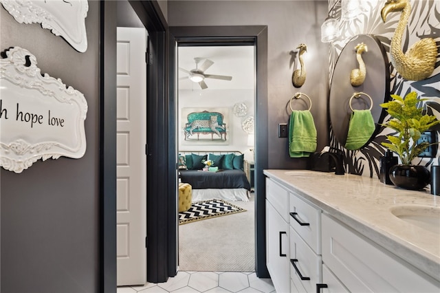 bathroom featuring ceiling fan, vanity, and tile patterned floors