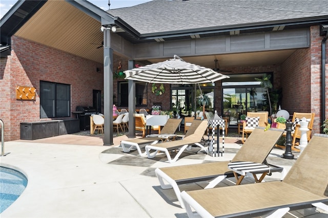 view of patio / terrace featuring a pool