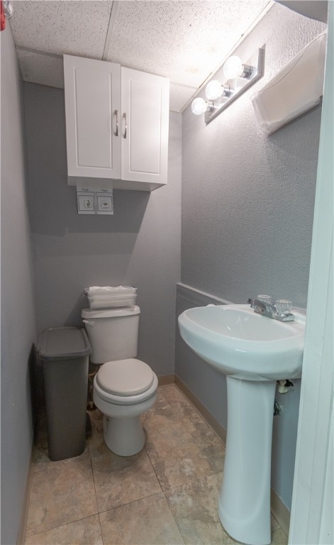 bathroom featuring tile patterned flooring and toilet