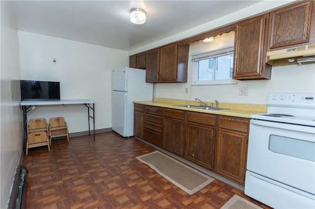 kitchen with white appliances, dark parquet flooring, sink, and custom exhaust hood