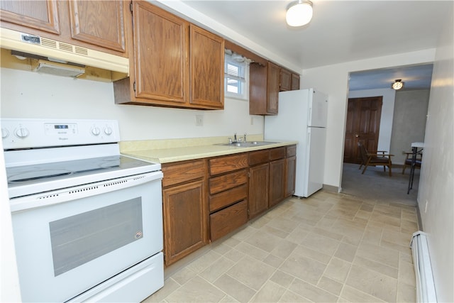 kitchen featuring a baseboard radiator, sink, and white appliances