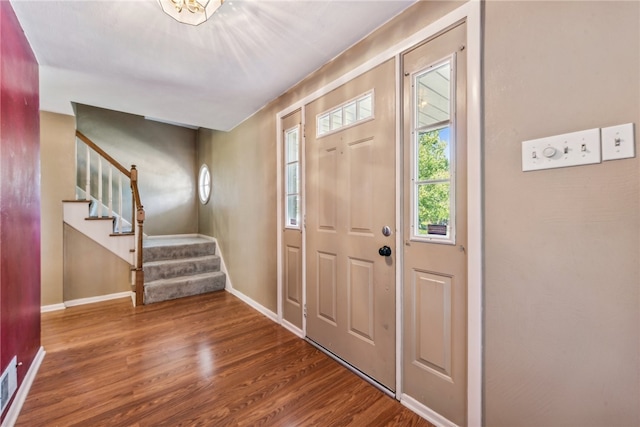 entryway with hardwood / wood-style flooring