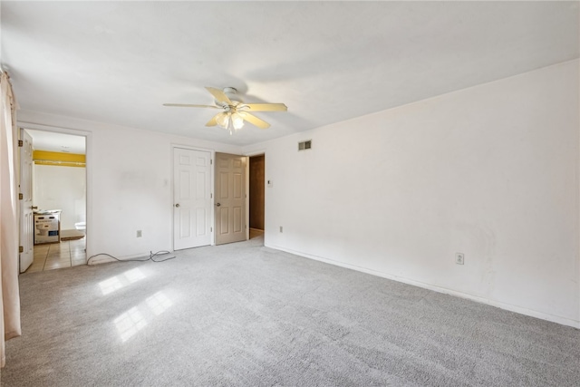 unfurnished bedroom with ceiling fan and light carpet