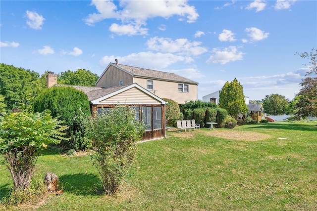 view of yard with a sunroom